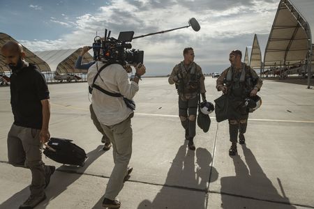 DOP Jon Southgate-Sayers films student LTJG Evan Morris and his instructor as they return from a flight. (National Geographic/Freddie Claire)