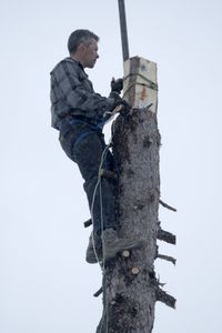 Joel Jacko installs a windmill on his property for additional power. (National Geographic/Wayne Shockey)