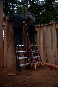 Terry Simpson is grateful for his friend David Squibb's help in building him a new cabin. (National Geographic/Robert Jolley)