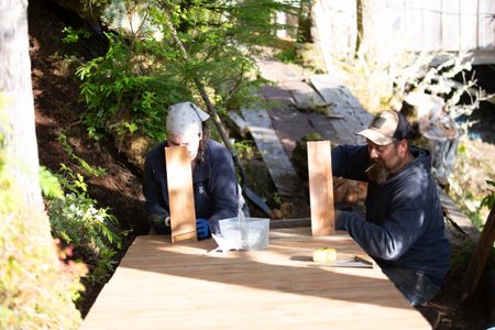 Veronica Arrants is helped by Carl Hernandez with a ramp construction on her property. (National Geographic/Mickey Ramos)