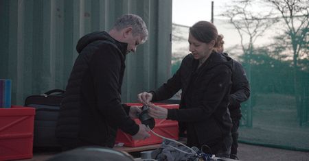 Susanne Holtze and Thomas Hildebrant from BioRescue prepping ultrasound gear.  (credit: National Geographic)