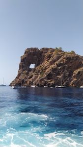 Recreational boats are anchored in a rocky cove in Ibiza, Balearic Islands, Spain. (National Geographic/Salvador Antonio Díaz Montes)