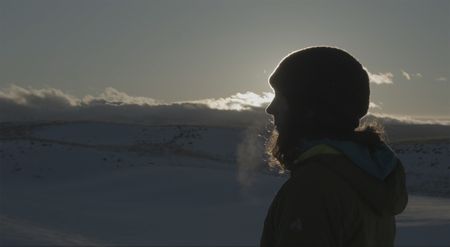 Polar Explorer Sarah McNair-Landry gazing at the mountains.  (photo credit: National Geographic /Ross McDonnell)