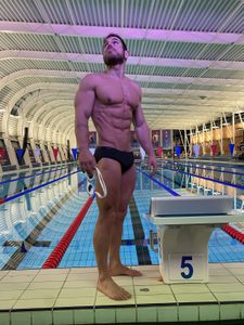 Ultra athlete record breaker, Ross Edgley, swam 1780 miles around Great Britain. Now he pitches himself against 4 sharks to go faster, be stronger, eat more, and turn at speed. (National Geographic/Nathalie Miles)