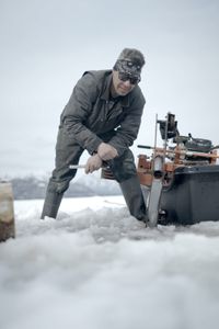 Joel Jacko transports his saw mill to cut wooden logs. (National Geographic/Wayne Shockey)