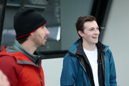 Erick Stackpole and Eric Ste-Marie chatting aboard the OceanXplorer. (National Geographic/Mario Tadinac)
