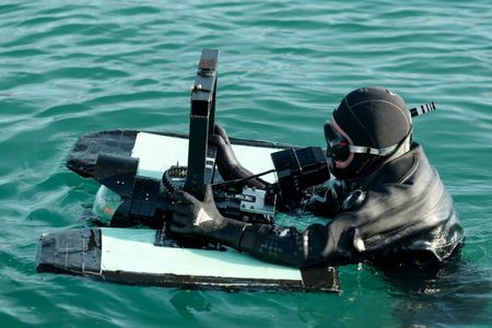 Crew John Chambers in scuba gear at the water's surface. (National Geographic/Mario Tadinac)