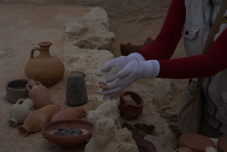 Kathleen Martinez holding the artifact believed to be Cleopatra. (credit: National Geographic)