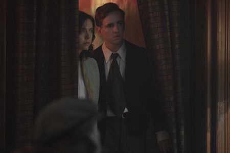 A SMALL LIGHT - Miep and Cas, played by Bel Powley and Laurie Kynaston, go to a bar to look for Jan, as seen in A SMALL LIGHT. (Credit: National Geographic for Disney/Dusan Martincek)