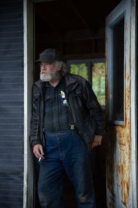 Terry Simpson is grateful for his neighbors' help in building him a new cabin. (National Geographic/Robert Jolley)