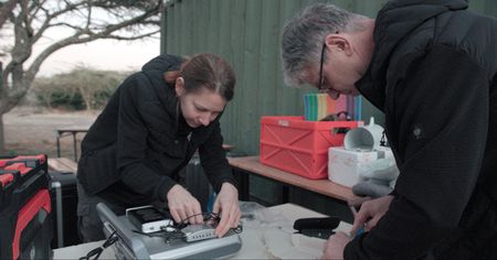 Susanne Holtze and Thomas Hildebrant from BioRescue prepping ultrasound gear.  (credit: National Geographic)