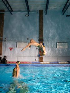 The Aquabatix synchro swim team show Ross how to power out of the water like a white shark. Imogen Smith and Samantha Wilson. (National Geographic/Nathalie Miles)