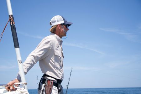 Capt. Greg Metzger focuses his sight on the water, searching for movement that could be a shark. (National Geographic/Brandon Sargeant)