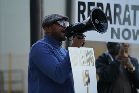 Rev. Robert Turner leads a protest calling for reparations for the victims of the 1921 Tulsa Race Massacre. (National Geographic/Christopher Creese)
