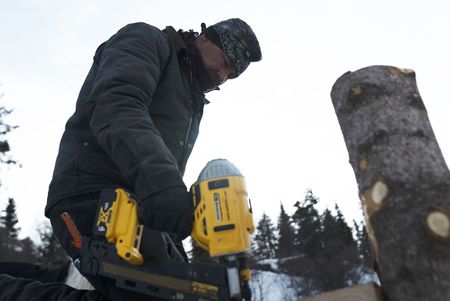 Joel Jacko builds a dock in the winter season. (National Geographic/Wayne Shockey)