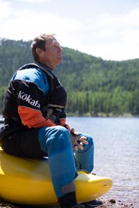 Professional kayaker Ben Stookesberry sits on his kayak and observes the water.  (National Geographic/Harrison Gayton)