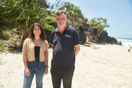 360 team member Melissa Cristina Márquez and shark expert Daryl McPhee on the beach at Ballina. (National Geographic/Justine Kerrigan)