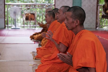 Monks pray in a temple in Mae Sot, Thailand. (National Geographic)