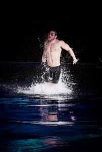 Ross Edgley gets 3/4 of his body out of the water as he tries to polaris like a white shark . (National Geographic/Bobby Cross)