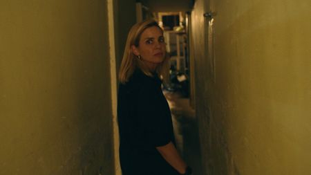 Mariana van Zeller walks along a corridor on her way to meet with 'V'. (Credit: National Geographic)