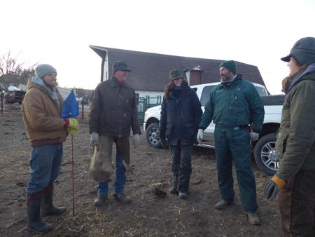 Cattle ranchers Mark Wortmann and Jerry Stewart, Drs. Ben and Erin Schroeder, and vet tech Laurel Driver celebrate the end of a long day of cattle work. (National Geographic)