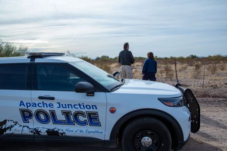 Bruce Anderson, Pima County Medical Examiner's Office, and Stephanie Bourgeois, Crime Scene Technician, Apache Junction PD, pinpoint the spot where the body of Jane Doe was discovered in 1992. (National Geographic/Tom Beard)
