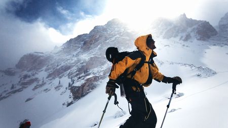 Professional skier walks up a mountain covered in snow.  (credit: Teton Gravity Research)