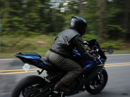 Student LTJG Marcus Figueroa on his motorcycle in Meridian, Mississippi. (National Geographic/Freddie Claire)