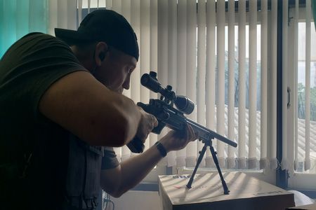 A reenactment of the sniper working with the New South Wales Police Department during a 1992 hostage crisis at the Department of Community Services. (©2019 MCN International Pte Ltd. All Rights Reserved.)