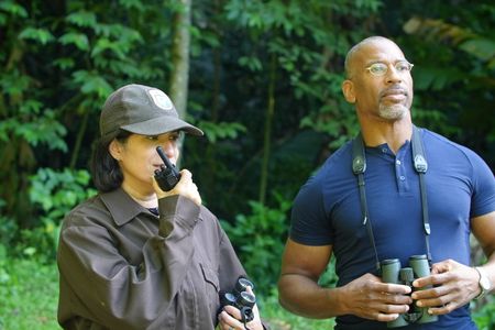 Christian Cooper observes the historic release of 7 Puerto Rican Parrots into the wild with Marisel López-Flores Lopez, the Project Leader of the Puerto Rican Parrot Recovery Program. (National Geographic for Disney)