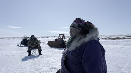 Teresa Pingayak ice fishing. (National Geographic/Matt Kynoch)