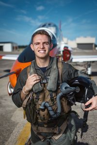 Student LTJG Evan Morris posing in front of a T-45. (National Geographic/Freddie Claire)