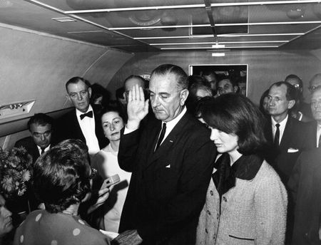Lyndon B. Johnson is sworn in as President of the United States during ceremony aboard Air Force One, Nov. 22, 1963, in Dallas. Former first lady Jacqueline Kennedy stood beside him during the ceremony. (Cecil Stoughton/White House Photographs/John F. Kennedy Presidential Library and Museum, Boston).