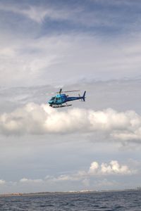 The OceanXplorer's helicopter flies low over the coastal waters of Bimini. (National Geographic/Paige McGarvin)