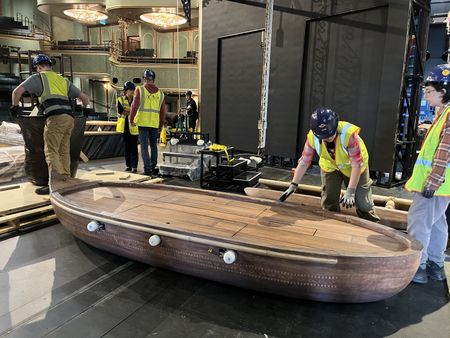 A team in the Walt Disney Theater unwrap Moana's canoe, a central set piece for "Disney The Tale of Moana."  (credit: National Geographic/Jenn Brehm)