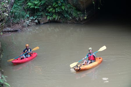 Christian Cooper and Jorge emerge from the subterranean cave in their kayaks on their way to find the endmeic Puerto Rican Tody. (National Geographic for Disney)
