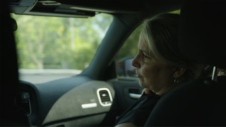 DNA Doe Project volunteer Rebecca Somerhalder rides with Sgt. Micheal Young to investigate a possible lead to Fulton County John Doe's identity. (National Geographic/Tom Beard)