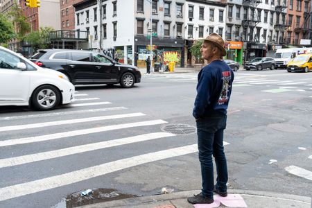 Kevin Shea, who worked as a firefighter for the New York Fire Department during the 9/11 attacks, waits on the street to be reunited with Al Kim. (National Geographic/Virginia Sherwood)
