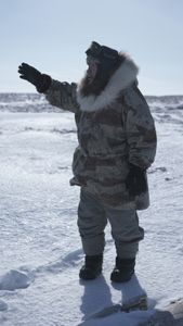 John Pingayak collects firewood on the frozen tundra. (National Geographic/Matt Kynoch)