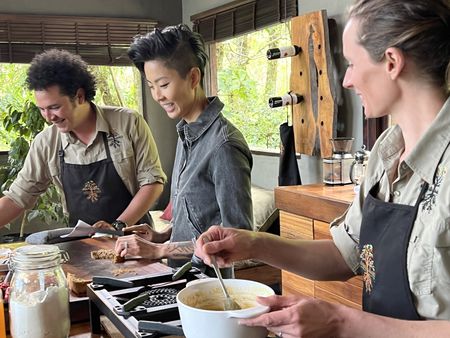 Chef Kristen Kish cooks with Chef Rolando Chamorro and his wife Gabriella Carlsson at their restaurant in Hacienda Mamecillo, Boquete, Panama. (National Geographic for Disney/Missy Bania)