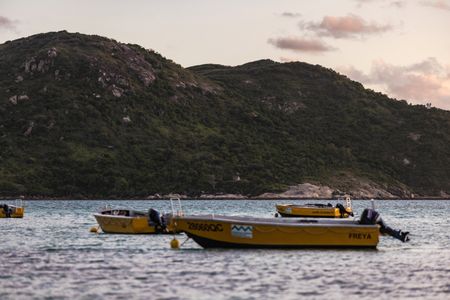 Lizard Island Research Station vessels moored by the shore on the Great Barrier Reef.   (photo credit: National Geographic/Harriet Spark)