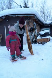 Sonta Roach teaching her daughter Chevelle how to walk across snow in snowshoes. (BBC Studios Reality Productions, LLC/Jayce Kolinski)