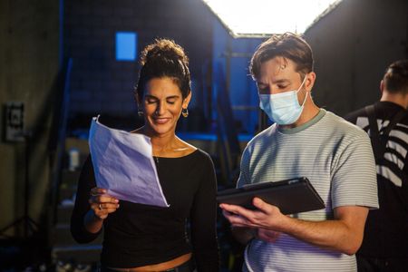 Diva Amon looking through lines with director Martin Cass during the studio lab shoot. (National Geographic/Aubrey Fagon)