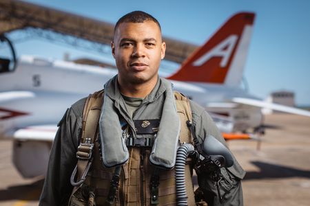 Portrait of student Captain Micah Nissly next to a T-45. (Credit: National Geographic/Freddie Claire)