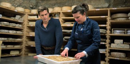 Antoni Porowski visits the cheese basement of Fromagerie Quatrehomme with owner Nathalie. (National Geographic)
