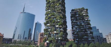 Unicredit's striking glass-clad skyscraper and Bosco Verticale's two residential towers.  (credit: National Geographic)