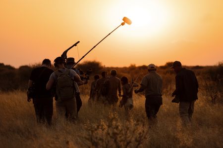 Will Smith and San Bushman Guide Kane Motswana follow the San people through the Kalahari Desert searching for food.  (credit: National Geographic/Kyle Christy)