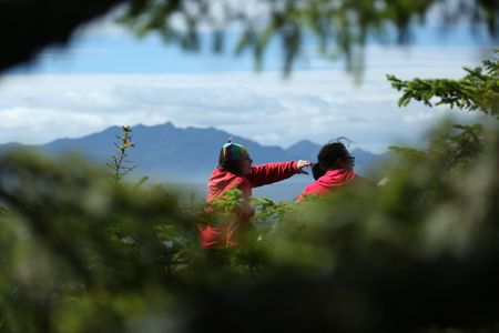 Veronica Arrants and Breanna Miethe pick berries. (National Geographic/Wayne Moss)