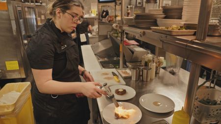 Alison Parisi at Air Canada Signature Suite Executive Chef at Air Canada, prepares tenderloin steaks to be served to customers. (Arrow International Media Ltd & Cantina Media)