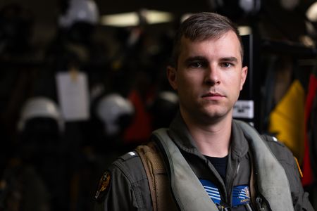 Student LTJG Andrew Seepe smiles in the paraloft on base. (Credit: National Geographic/Freddie Claire)